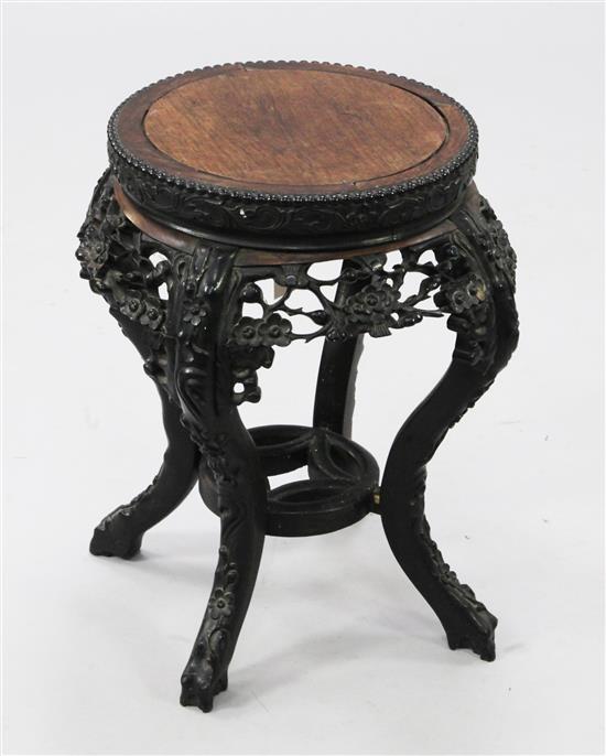 A Chinese ebonised hongmu stand, late 19th century, H.50cm